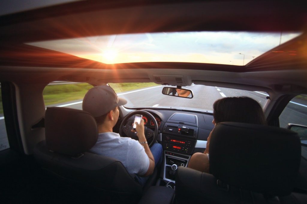 Man Driving Distracted by Phone