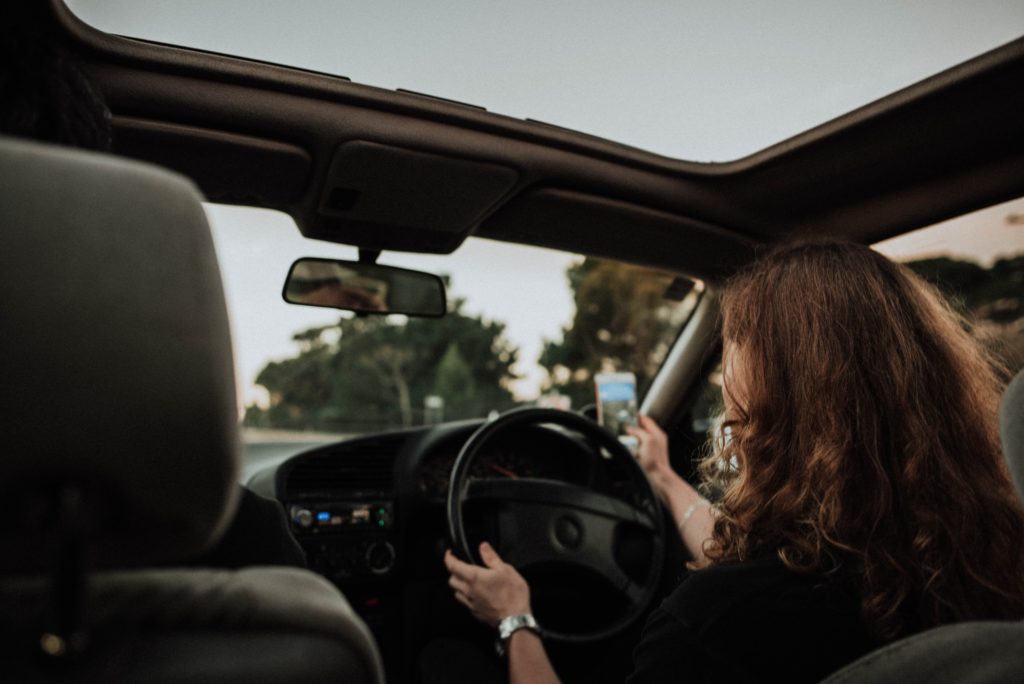 Girl in Car with phone